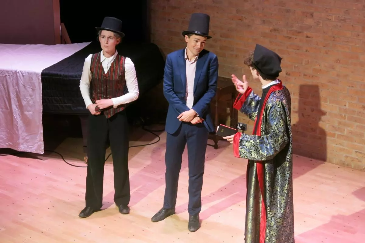 The vicar Dr. Daly converses with Sir Marmaduke and his son Alexis.